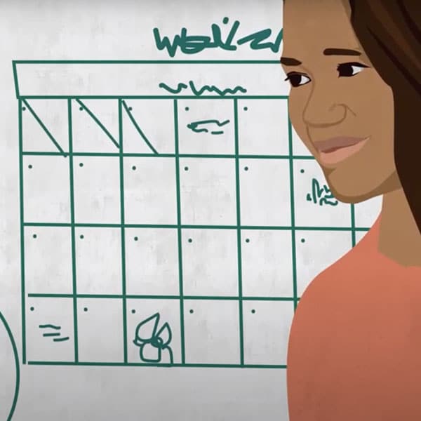 A business owner setting weekly business goals using a calendar