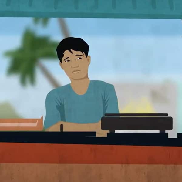 A man at his food stand who is unhappy